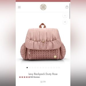 Happ baby diaper bag strap has original tie on it and zippers have plastic